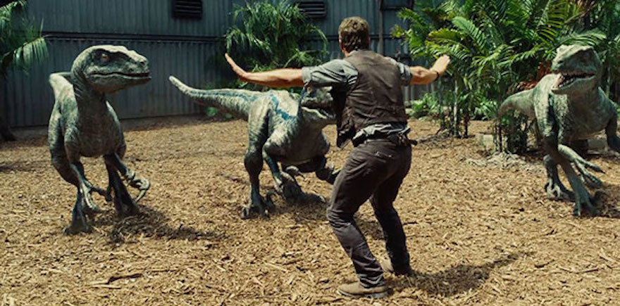 Chris Pratt holding raptors at Bay in Jurassic World